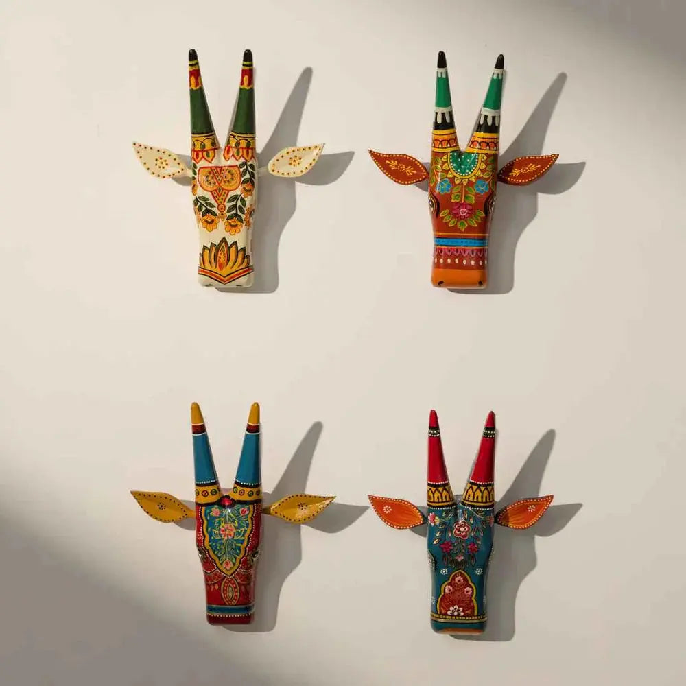 carved wooden cow head wall décor