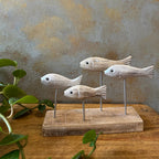 Wooden fish sculpture home decor with four carved fish on stand